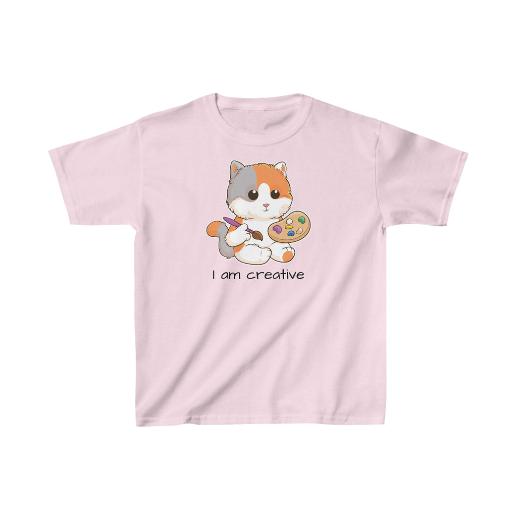 A short-sleeve light pink shirt with a picture of a cat that says I am creative.