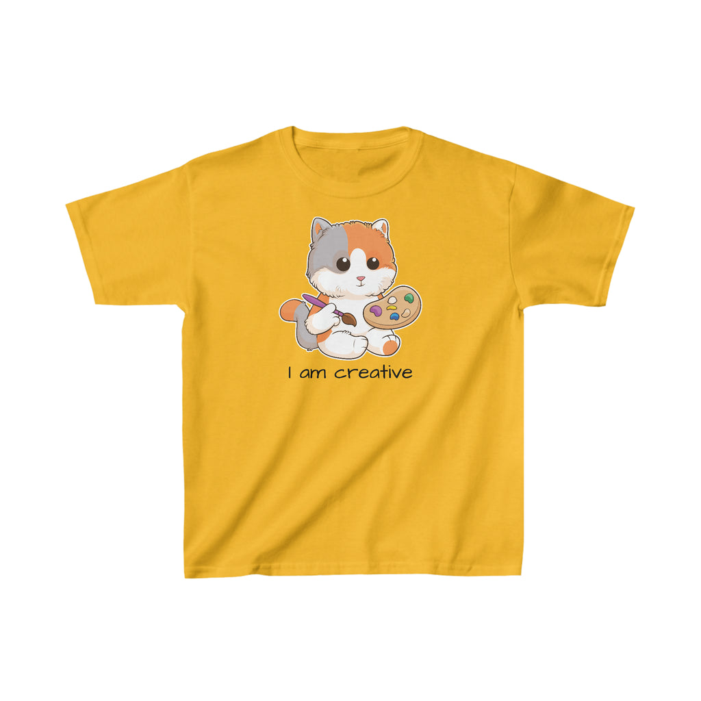 A short-sleeve golden yellow shirt with a picture of a cat that says I am creative.
