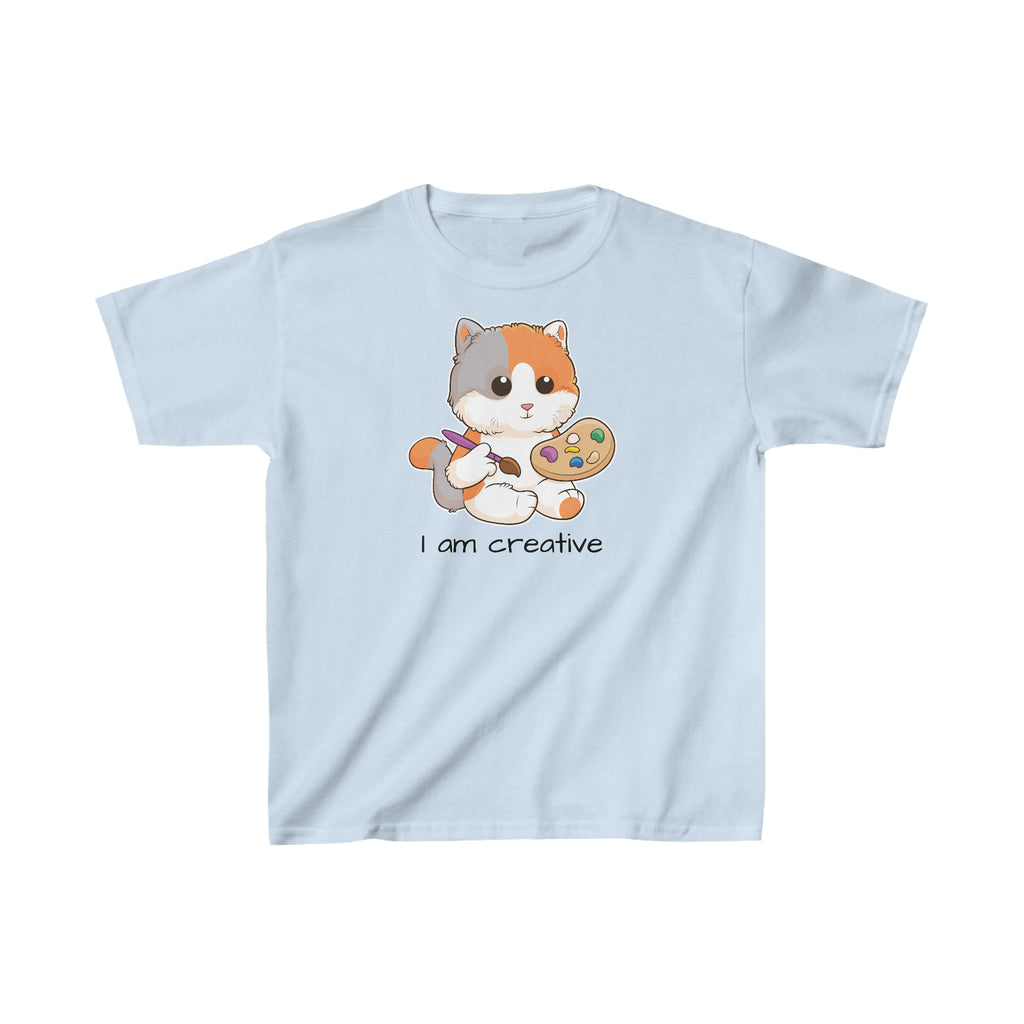 A short-sleeve light blue shirt with a picture of a cat that says I am creative.