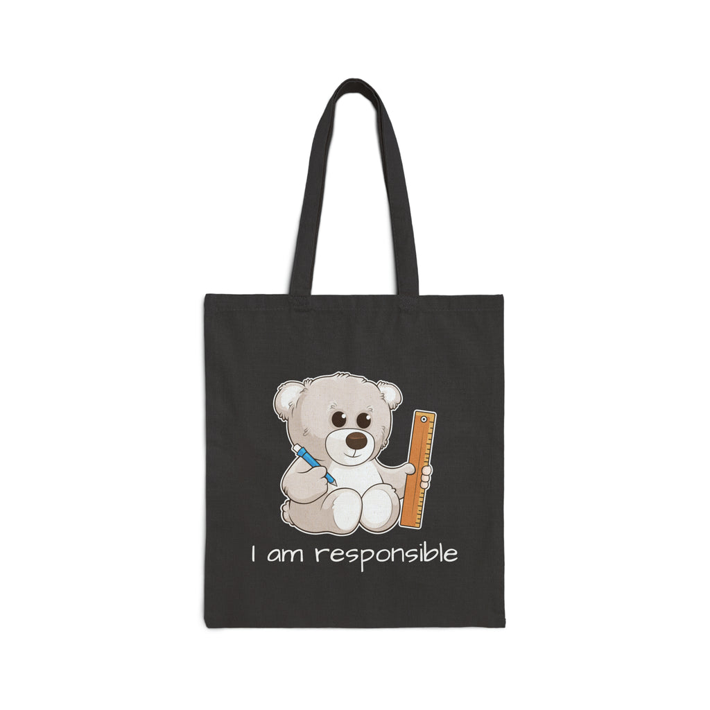 A black tote bag with a picture of a bear that says I am responsible.