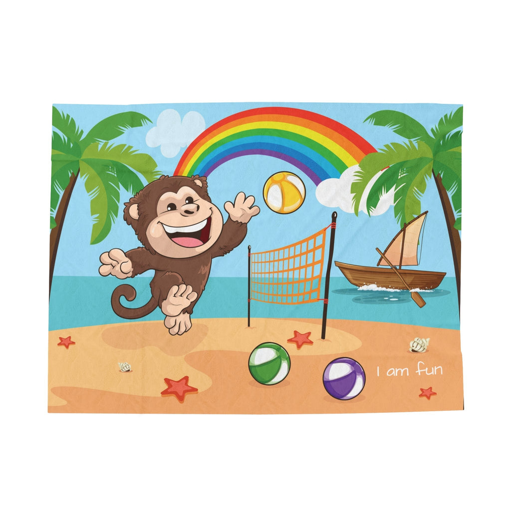A blanket that has a scene of a monkey playing volleyball on the beach, a rainbow in the background, and the phrase "I am fun" along the bottom.