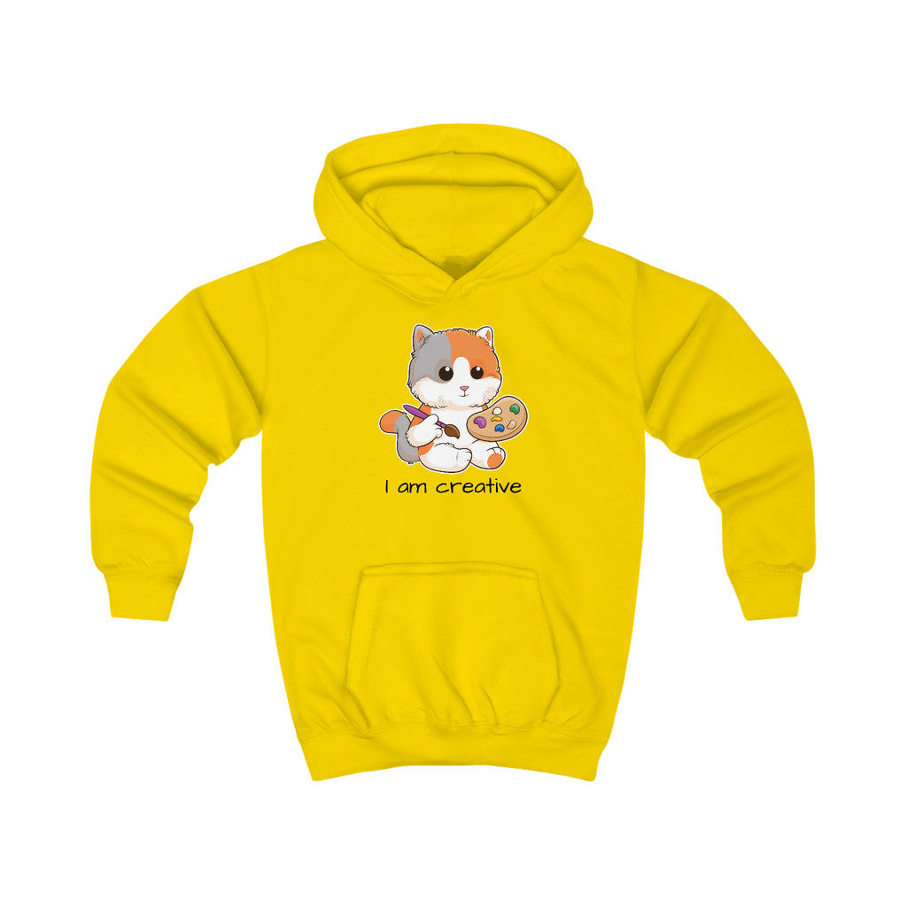 A yellow hoodie with a picture of a cat that says I am creative.
