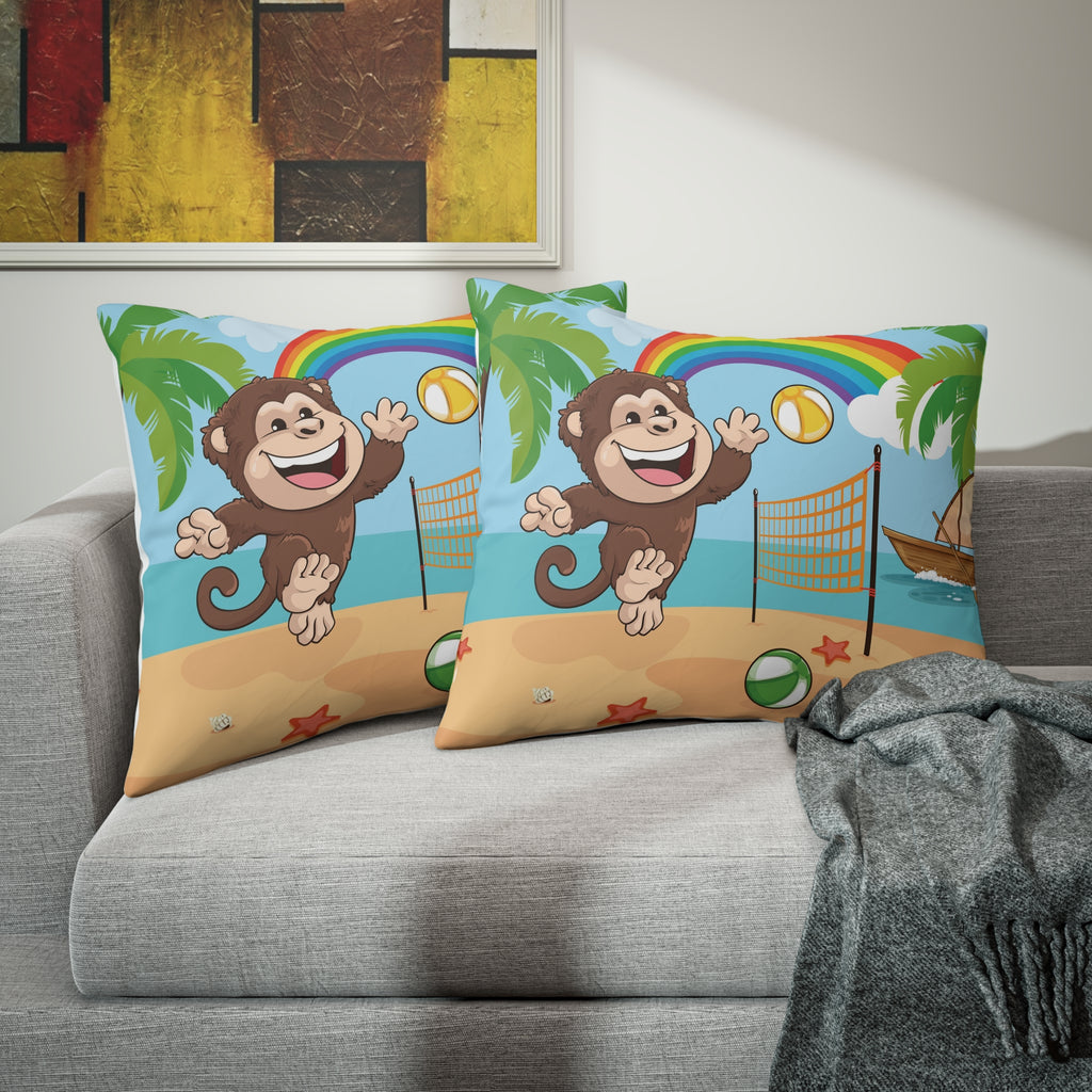 Two pillows sitting on a grey couch. The pillows have on pillowcases with a scene of a monkey playing volleyball on the beach, a rainbow in the background, and the phrase "I am fun" along the bottom.