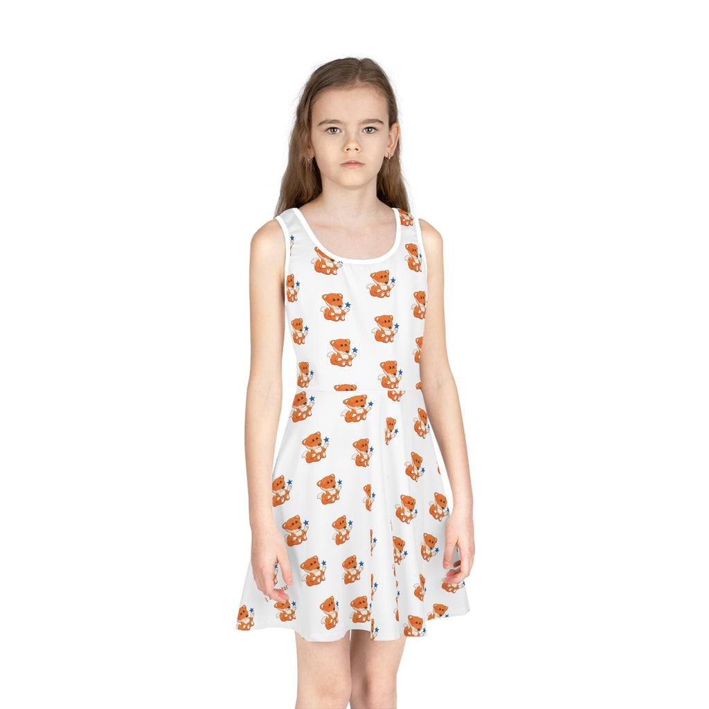 Front-view of a girl wearing a sleeveless white dress with a repeating pattern of a fox.