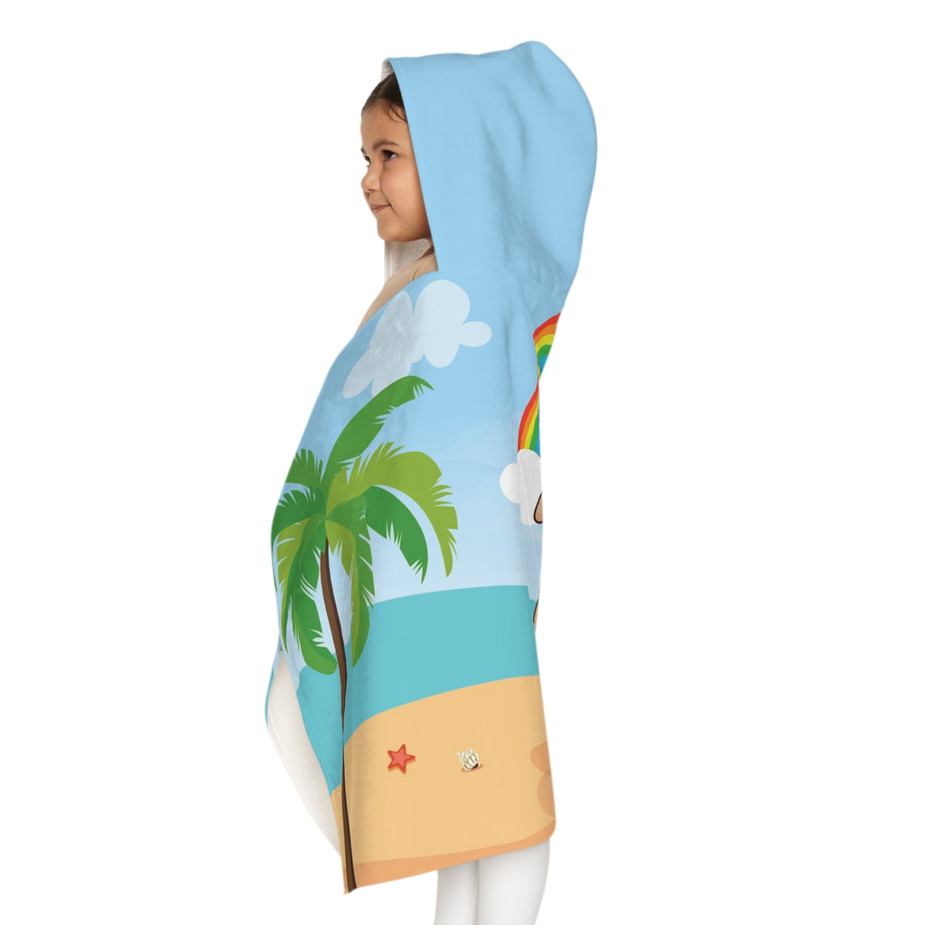 Left side-view of a girl wearing a hooded towel and holding it closed around her. The towel has a scene of a dog lifeguard standing on the beach, a rainbow in the background, and the phrase "I am loyal" along the bottom.