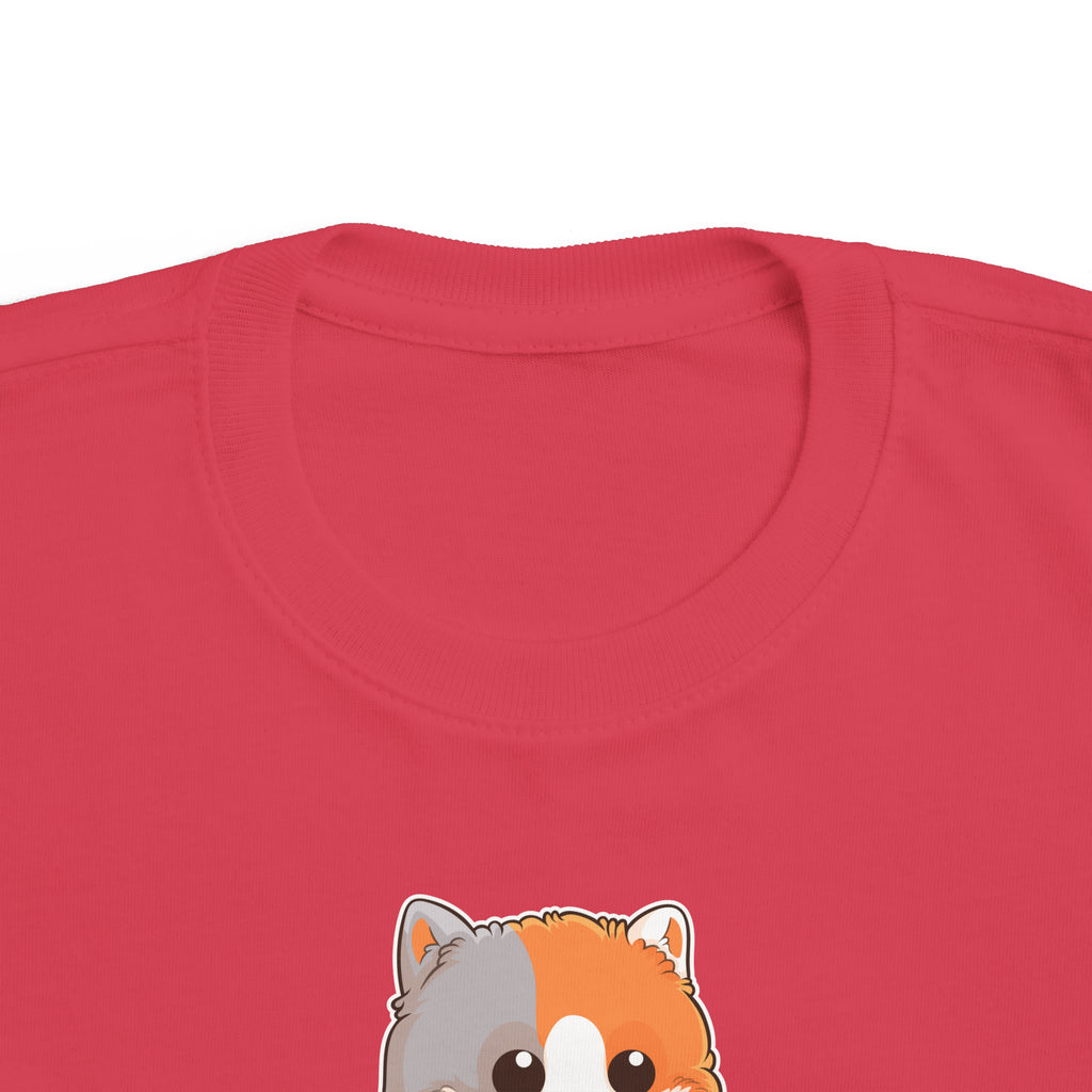 A close-up of the crew neckline of a short-sleeve red shirt with a picture of a cat that says I am creative.