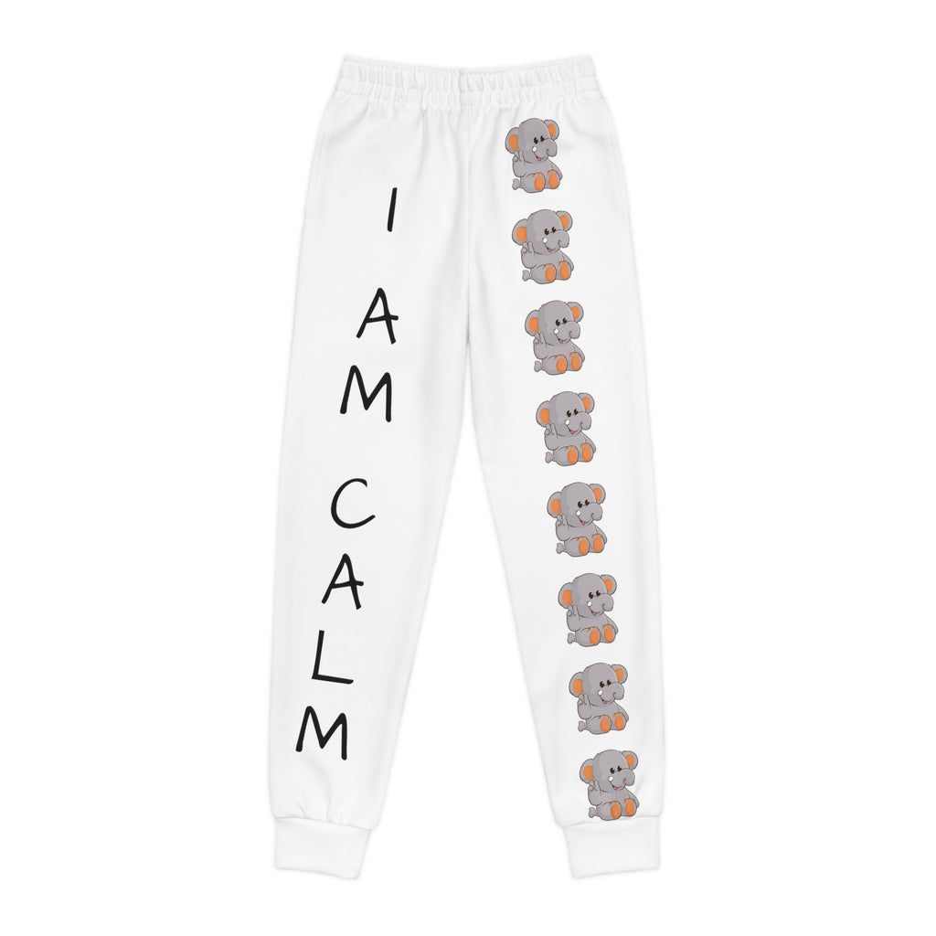 White sweatpants with a line of elephants down the front left leg and the phrase "I am calm" down the front right leg.
