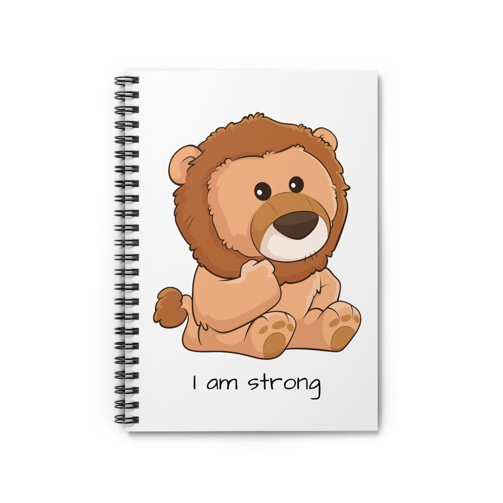 White spiral notebook laying closed, featuring a picture of a lion that says I am strong.