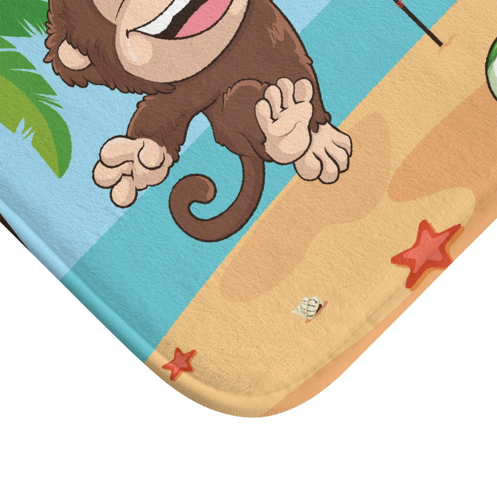 A close-up of a corner of the bath mat with a scene of a monkey playing volleyball on a beach.