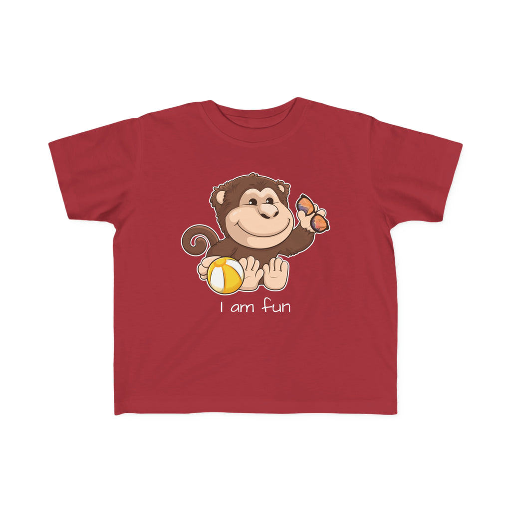 A short-sleeve garnet red shirt with a picture of a monkey that says I am fun.