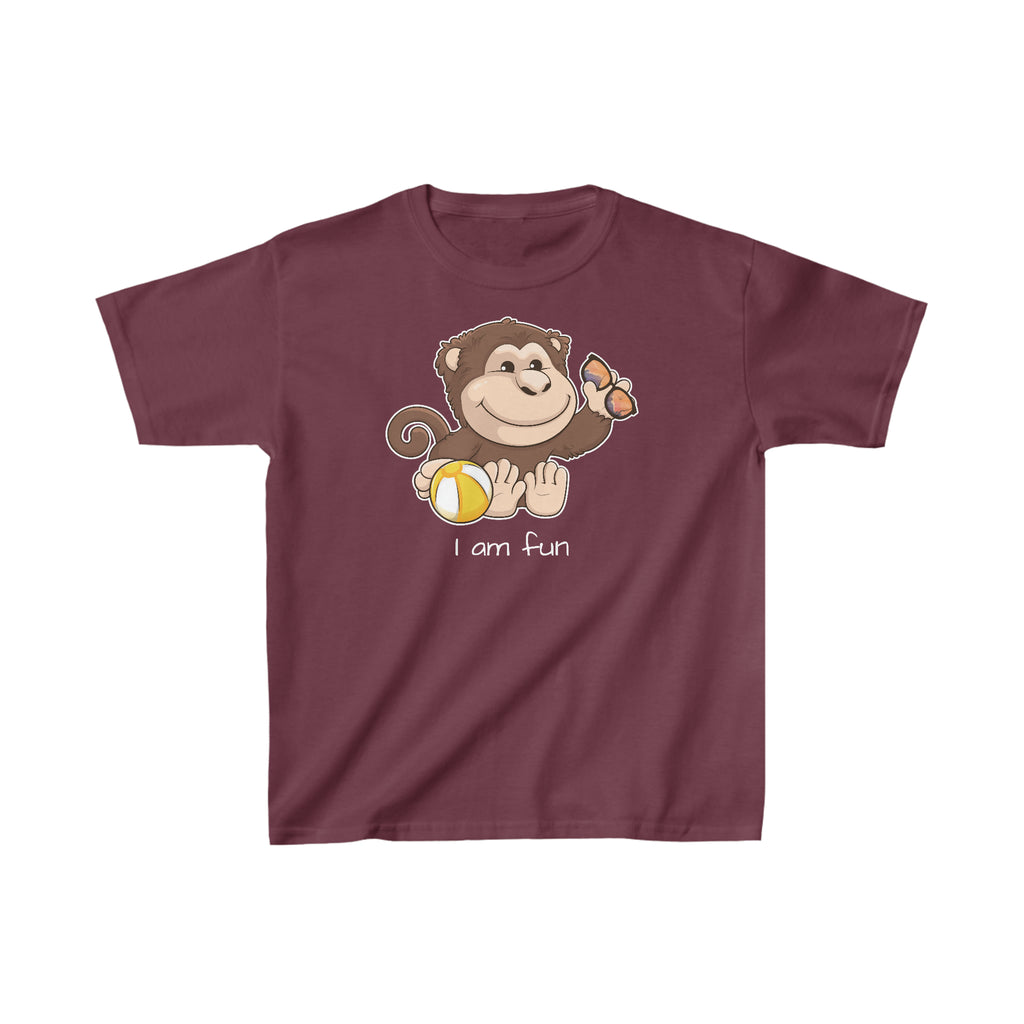 A short-sleeve maroon shirt with a picture of a monkey that says I am fun.