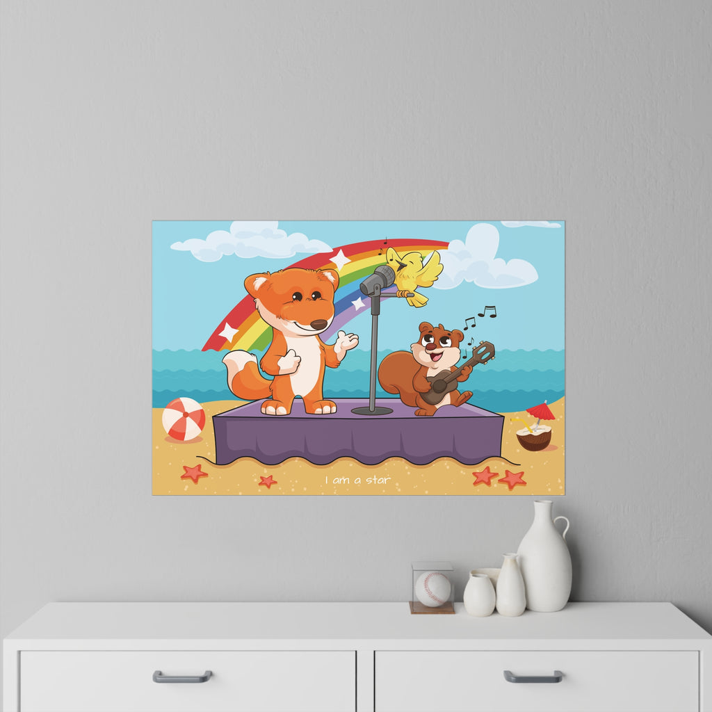 A 36 by 24 inch wall decal on a grey wall above a dresser. The wall decal has a scene of a fox singing with a squirrel and bird on a stage on the beach, a rainbow in the background, and the phrase "I am a star" along the bottom.