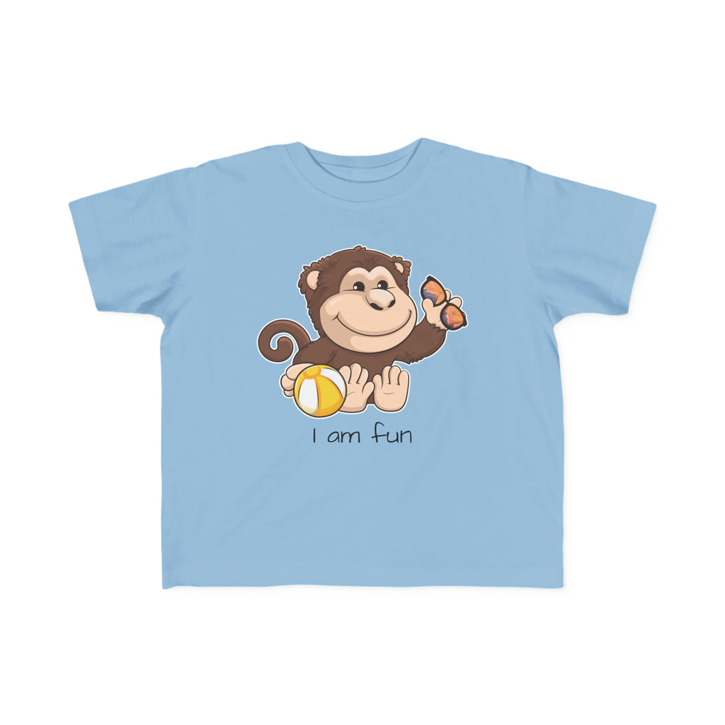 A short-sleeve light blue shirt with a picture of a monkey that says I am fun.