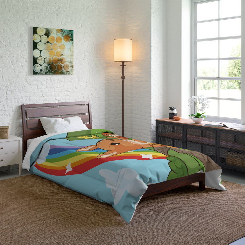 A 68 by 88 inch bed comforter with a scene of a kangaroo walking along a path through rolling hills, a rainbow in the background, and the phrase "I am loved". The comforter covers a twin-sized bed.