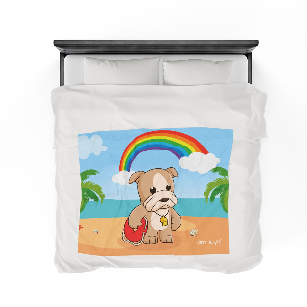 Top-view of a 50 by 60 inch blanket on a queen-sized bed. The blanket has a scene of a dog lifeguard standing on a beach with a rainbow in the background and the phrase "I am loyal" along the bottom.