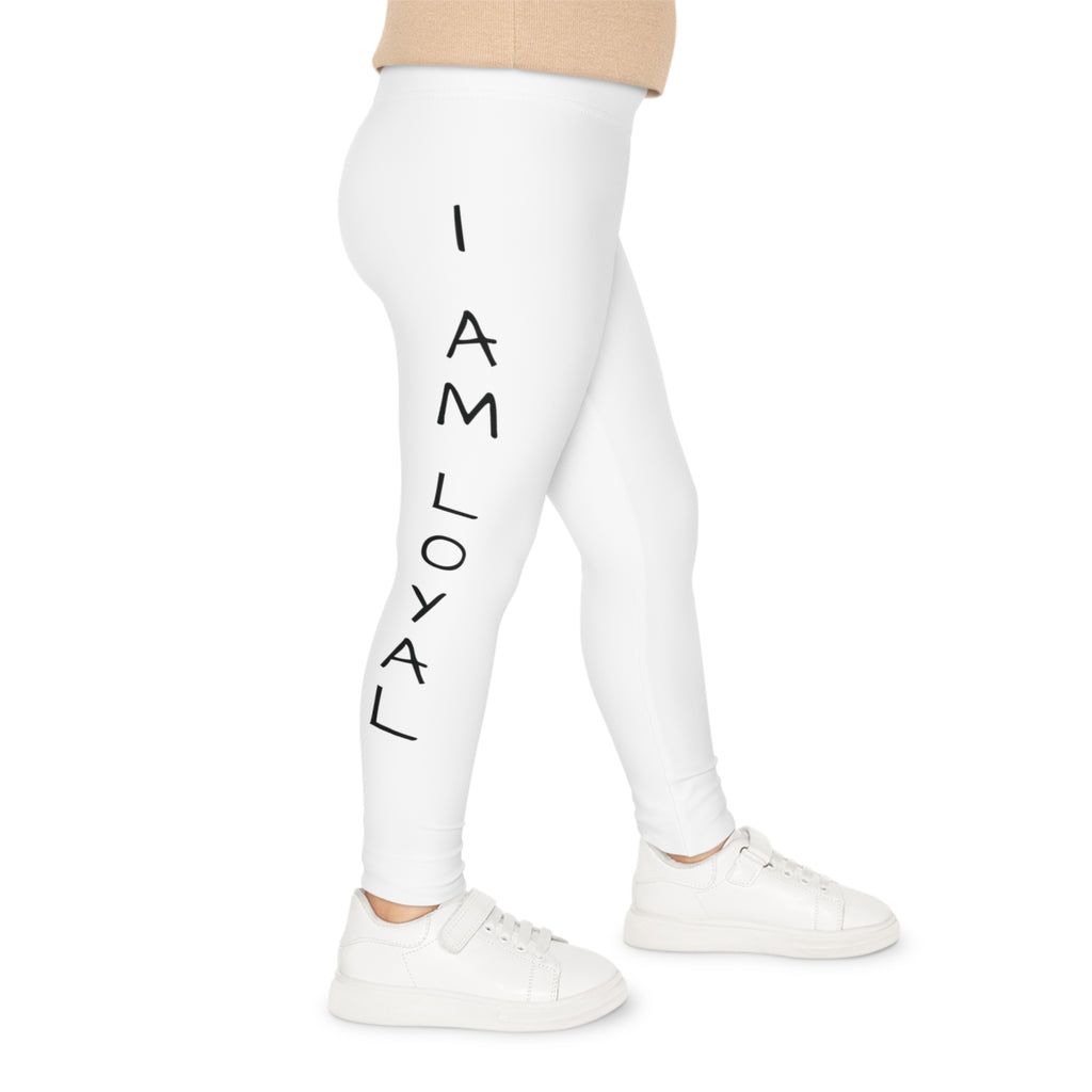 Right side-view of a child wearing white leggings with the phrase "I am loyal" read top to bottom on the side of the leg.