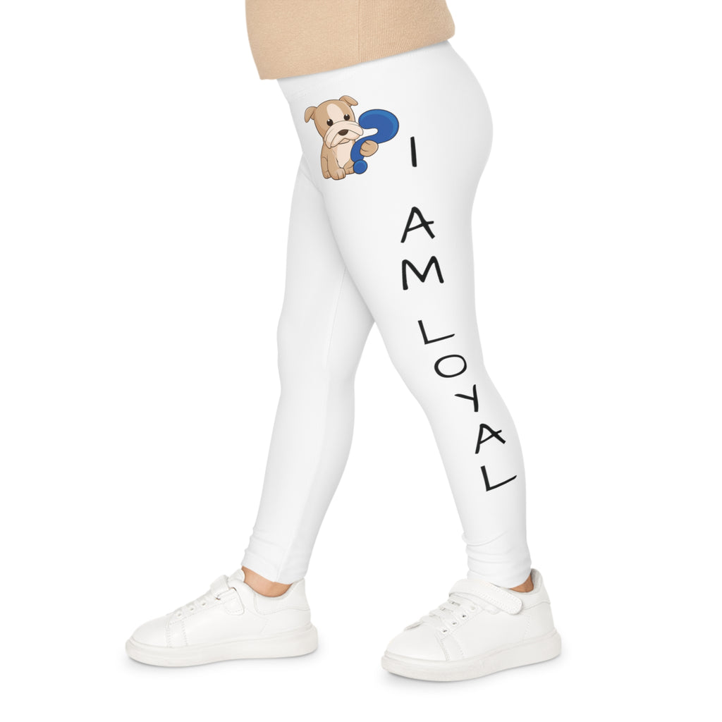 Left side-view of a child wearing white leggings with a picture of a dog on the front left waist and the phrase "I am loyal" read top to bottom on the side of the leg.