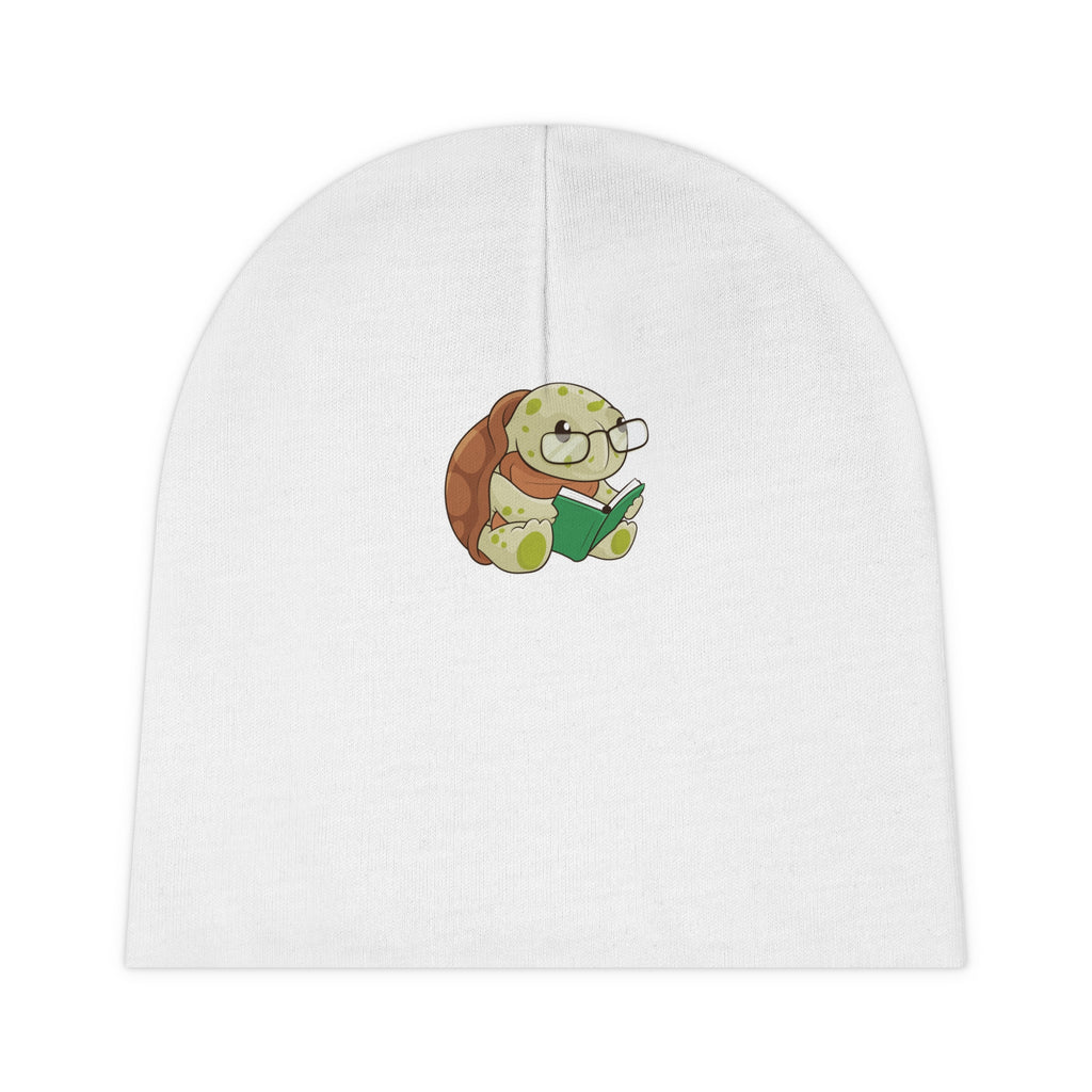A white baby beanie with a small picture of a turtle.