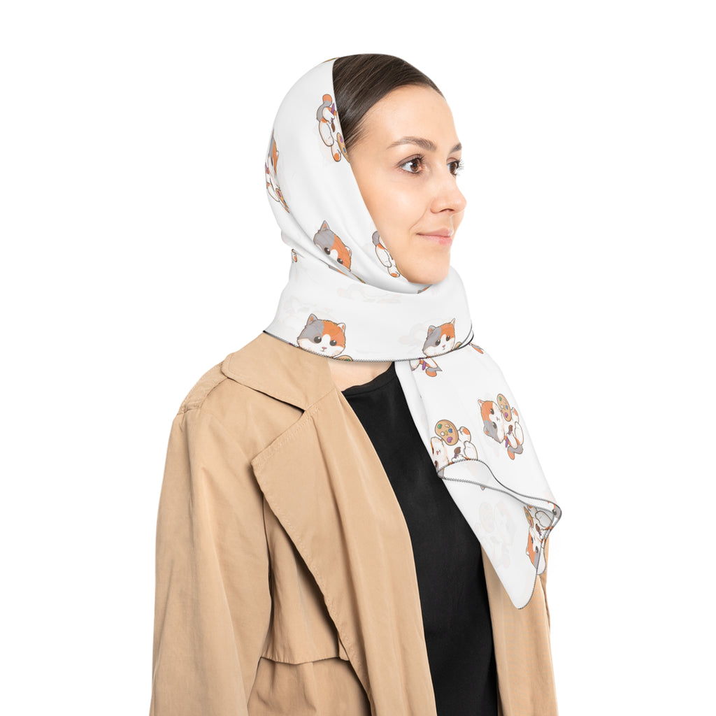 A female wearing a white scarf with a repeating pattern of a cat on her head.