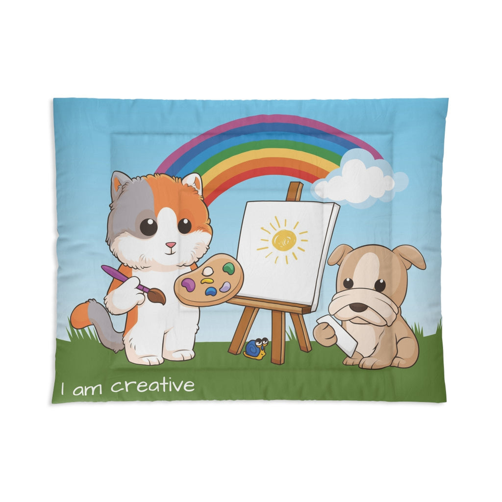 A 68 by 88 inch bed comforter with a scene of a cat painting on a canvas next to a dog, a rainbow in the background, and the phrase "I am creative" along the bottom.