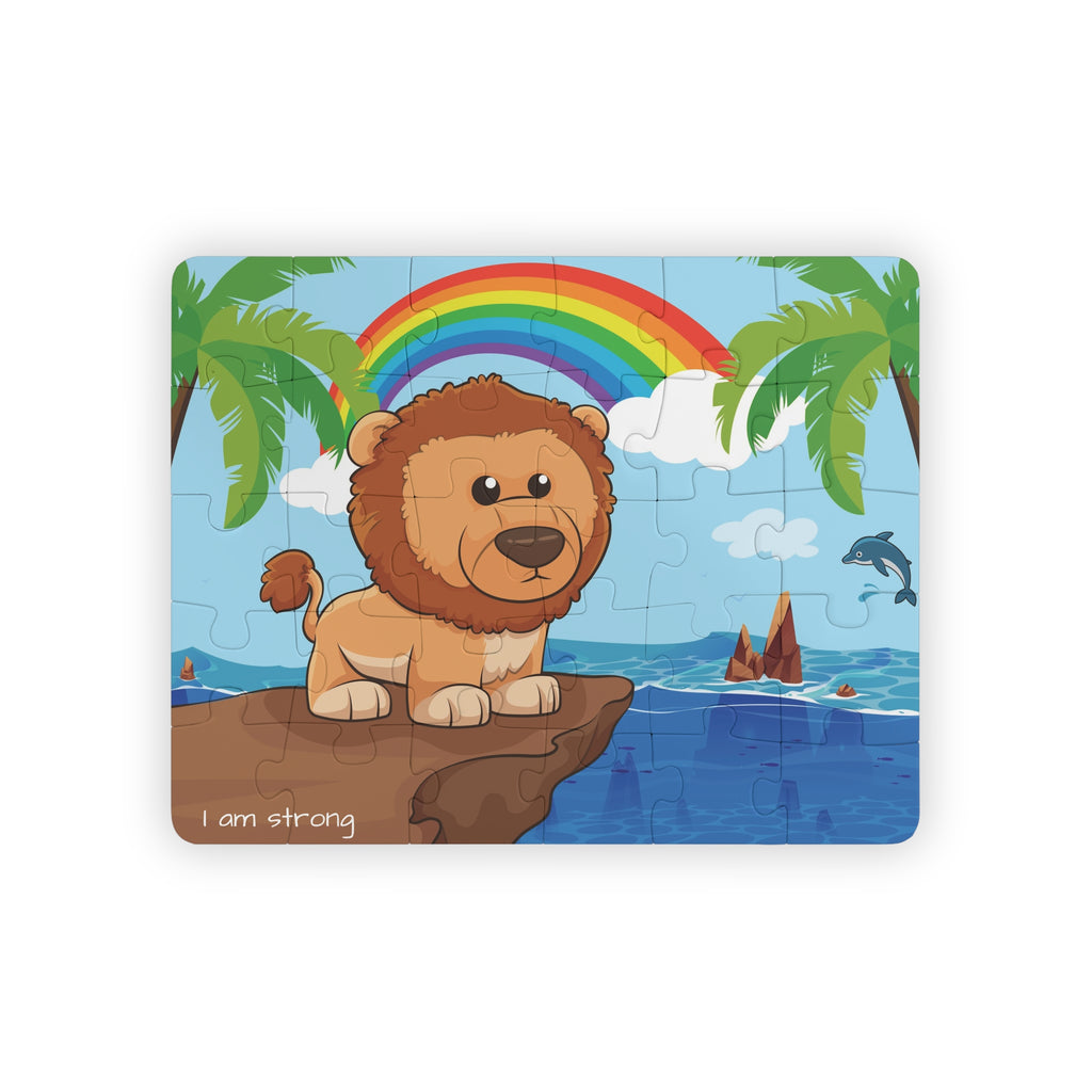 A 30 piece puzzle with a scene of a lion standing on a cliff over the ocean, a rainbow in the background, and the phrase "I am strong" along the bottom.