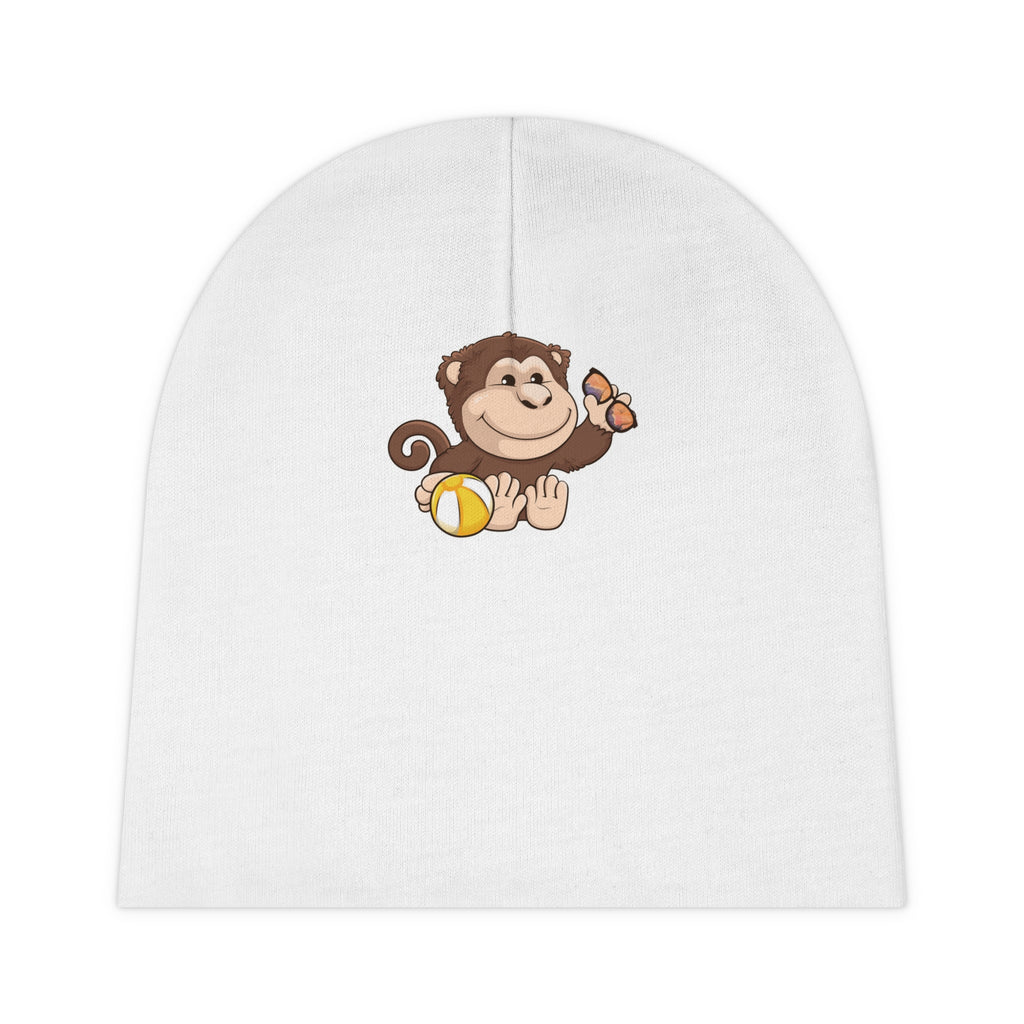 A white baby beanie with a small picture of a monkey.