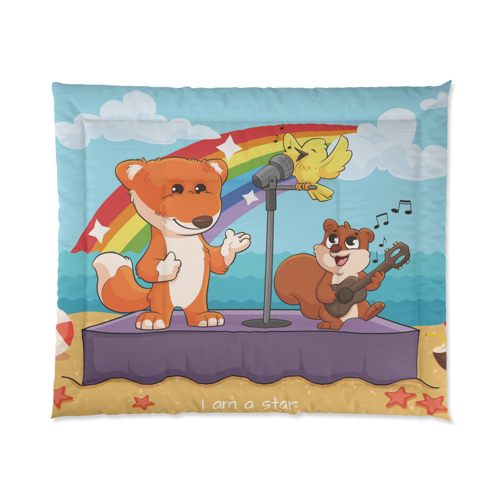 A 104 by 88 inch bed comforter with a scene of a fox singing with a bird and squirrel on a stage on the beach, a rainbow in the background, and the phrase "I am strong" along the bottom.