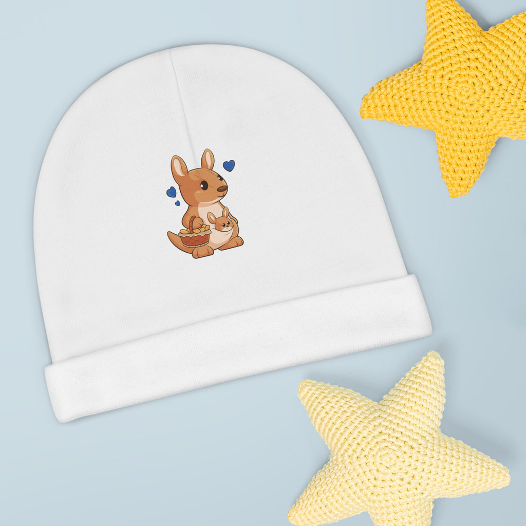 A white baby beanie with a small picture of a kangaroo. The beanie has the bottom edge folded up.