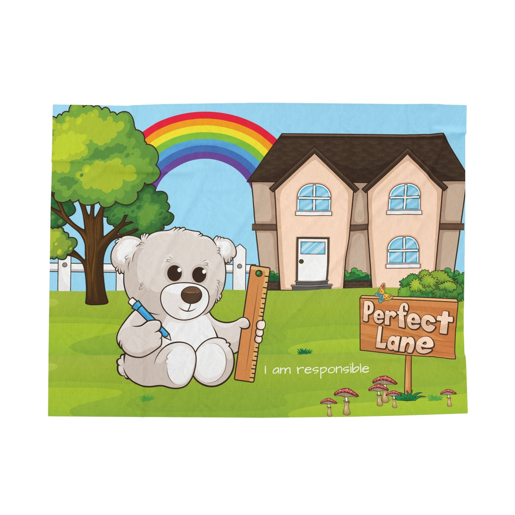 A blanket with a scene of a bear sitting in the yard of its house, a rainbow in the background, and the phrase "I am responsible" along the bottom.