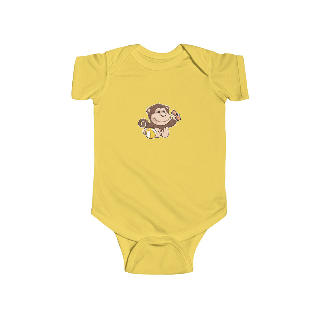 A yellow baby onesie with a picture of a monkey.