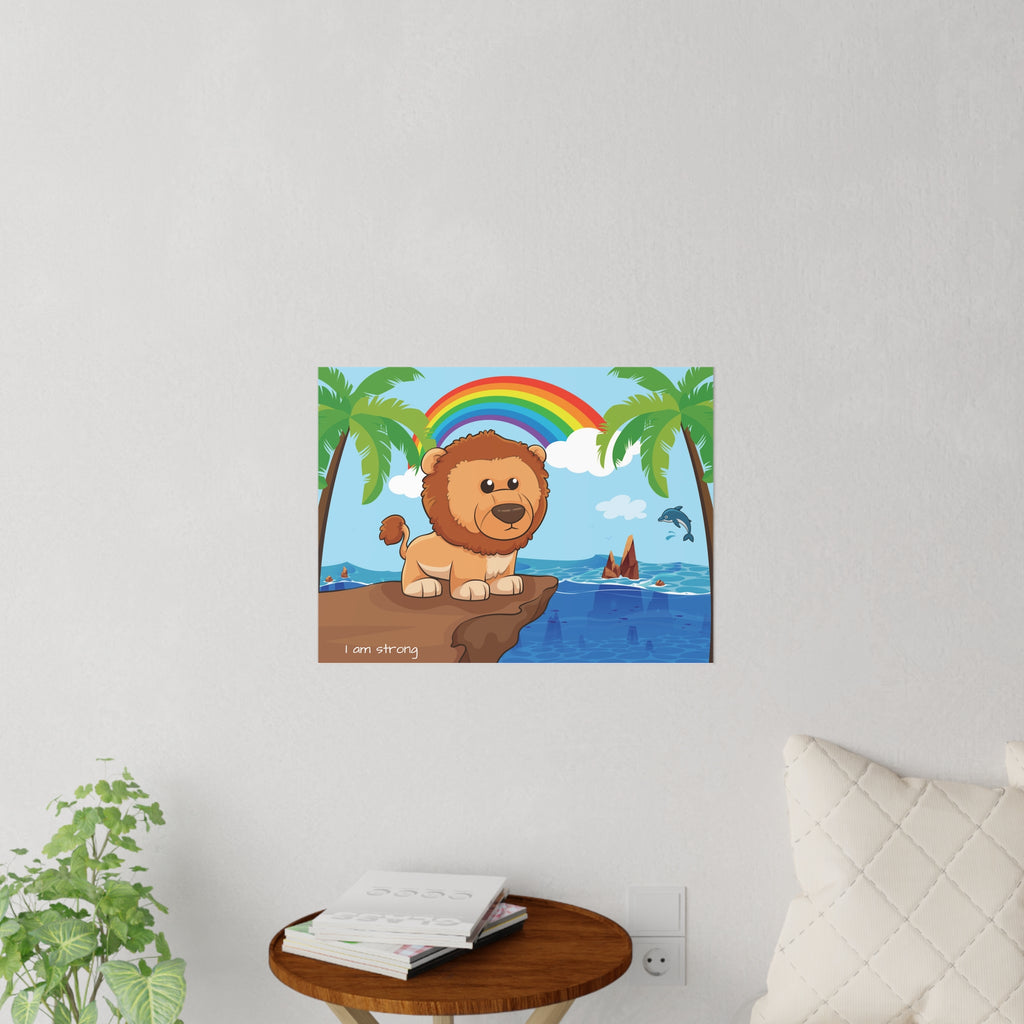 A 24 by 18 inch wall decal on a grey wall above a table and couch. The wall decal has a scene of a lion standing on a cliff over the ocean, a rainbow in the background, and the phrase "I am strong" along the bottom.