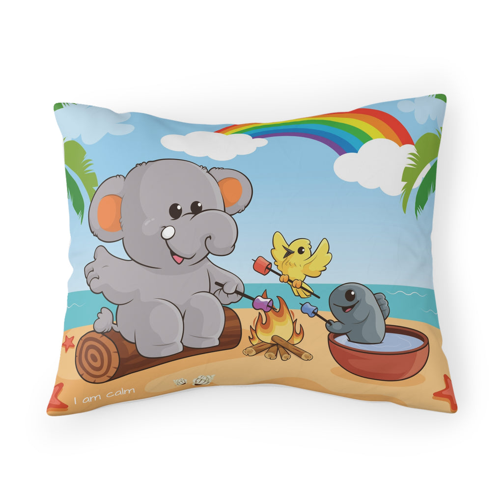 A pillowcase with a scene of an elephant having a bonfire with a bird and fish on the beach, a rainbow in the background, and the phrase "I am calm" along the bottom.