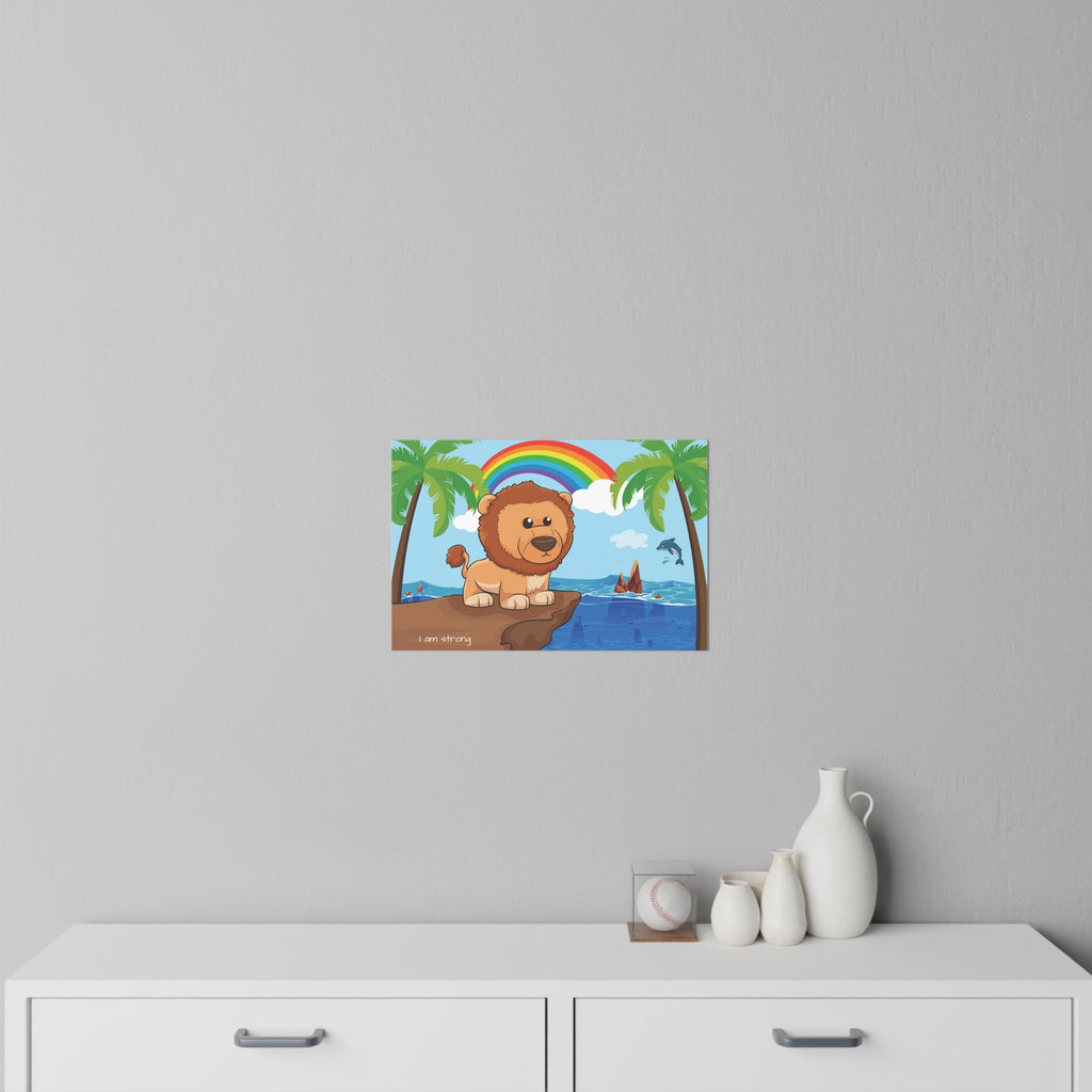 An 18 by 12 inch wall decal on a grey wall above a dresser. The wall decal has a scene of a lion standing on a cliff over the ocean, a rainbow in the background, and the phrase "I am strong" along the bottom.