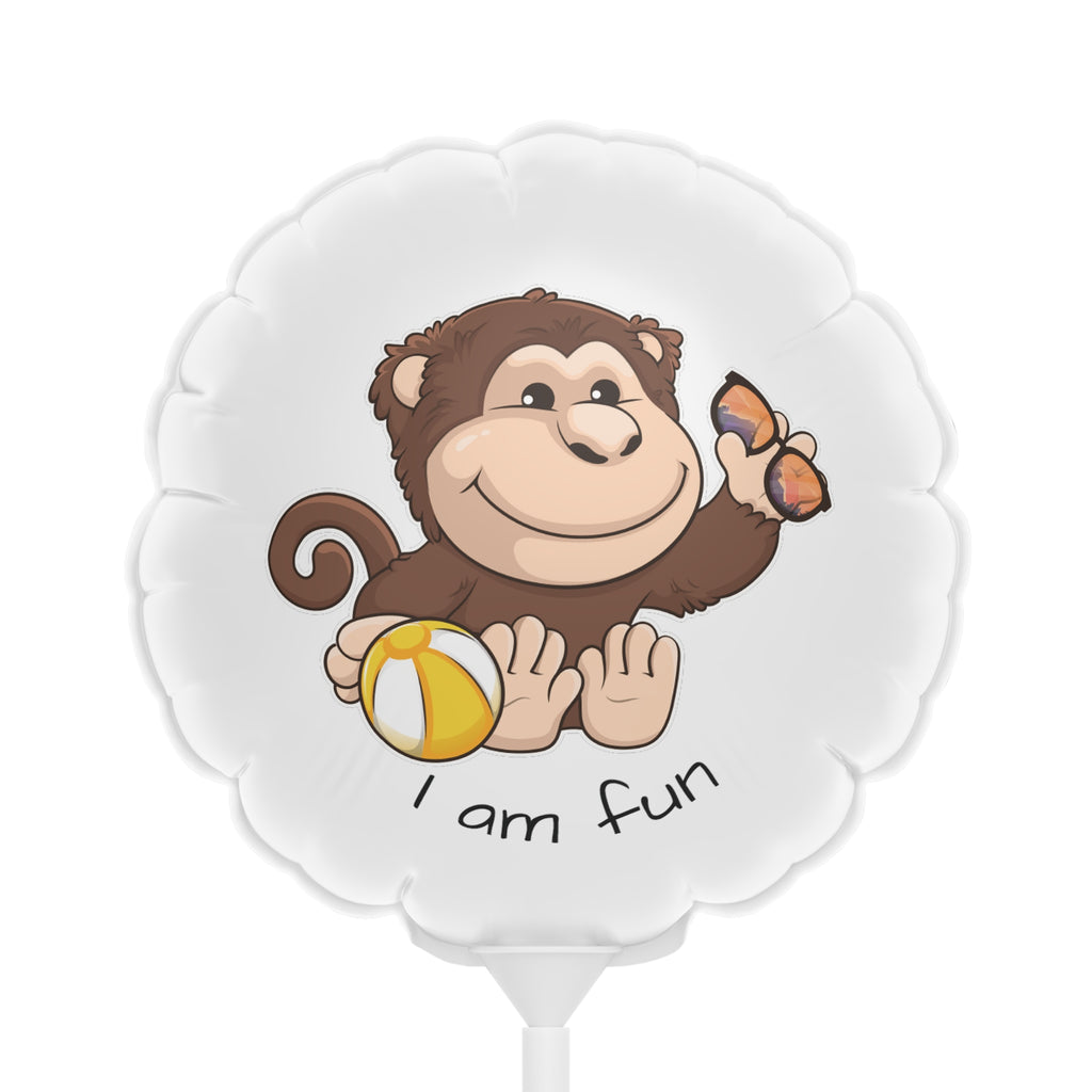 A round white mylar balloon on a stick with a picture of a monkey that says I am fun.