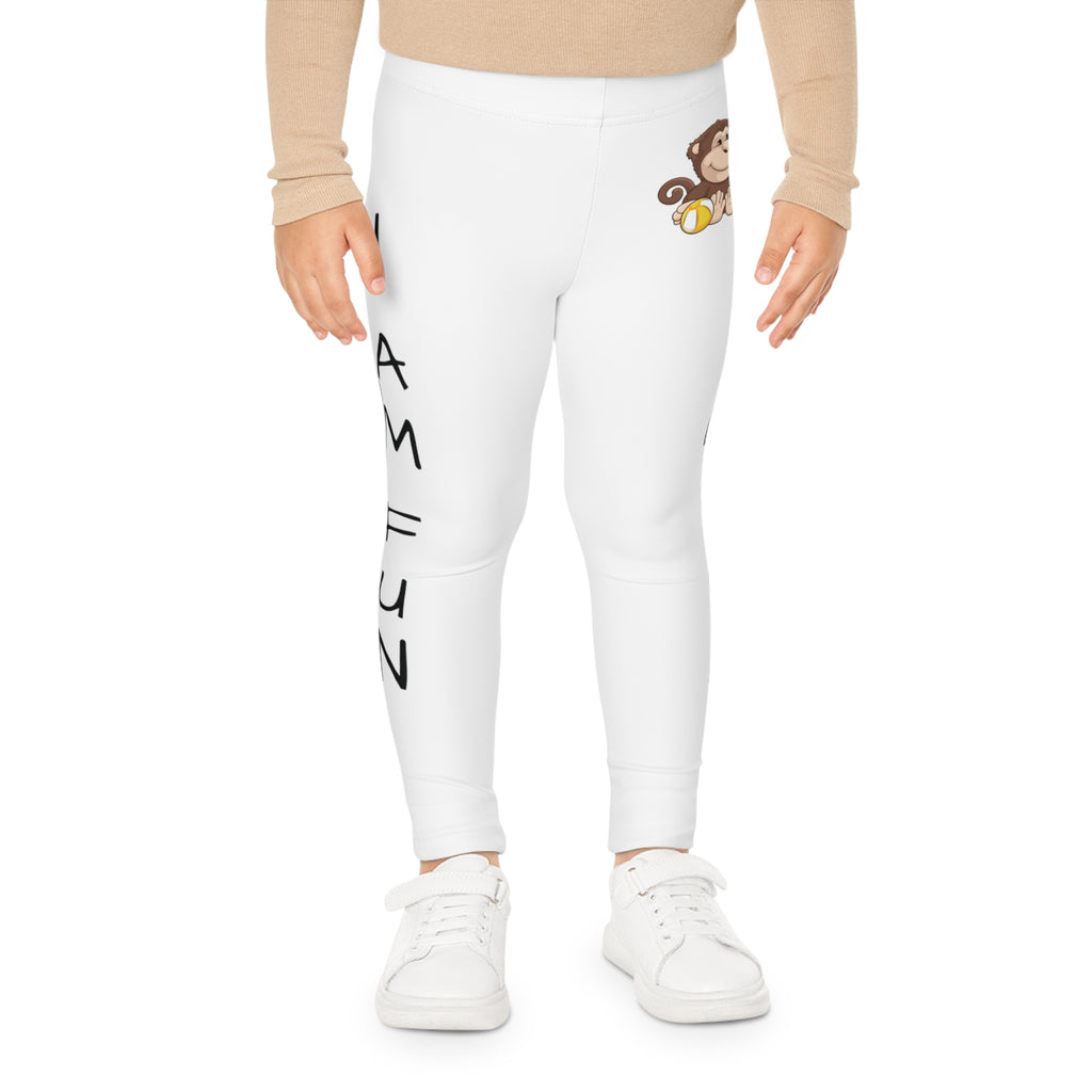 Front-view of a child wearing white leggings with a picture of a monkey on the front left waist and the phrase "I am fun" read top to bottom on the side of each leg.