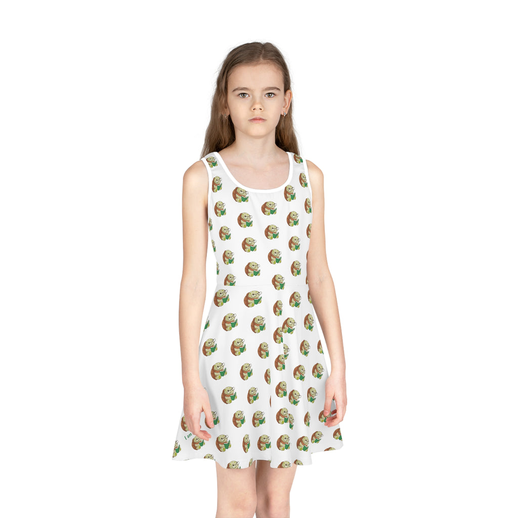 Front-view of a girl wearing a sleeveless white dress with a repeating pattern of a turtle.