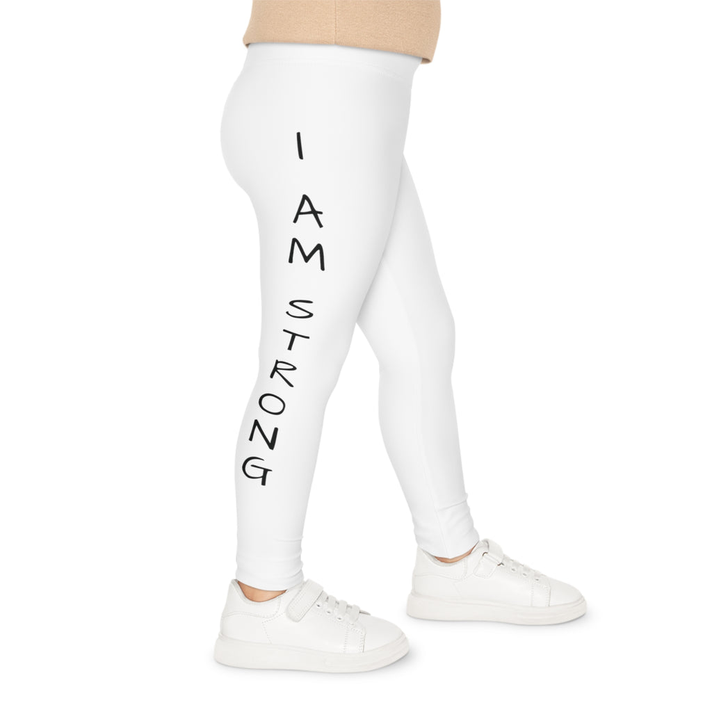 Right side-view of a child wearing white leggings with the phrase "I am strong" read top to bottom on the side of the leg.