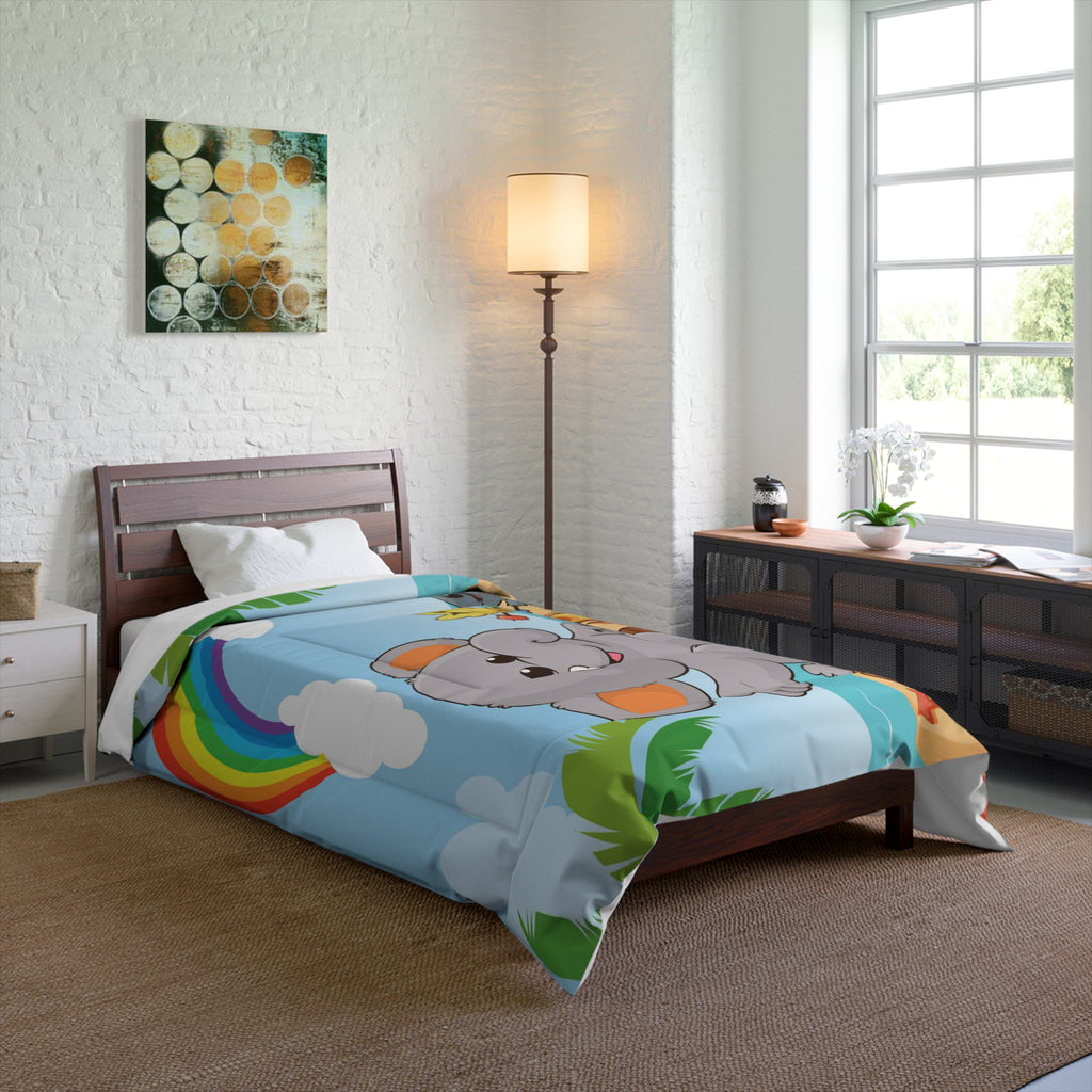 A 68 by 88 inch bed comforter with a scene of an elephant having a bonfire with a bird and fish on the beach, a rainbow in the background, and the phrase "I am calm" along the bottom. The comforter covers a twin-sized bed.