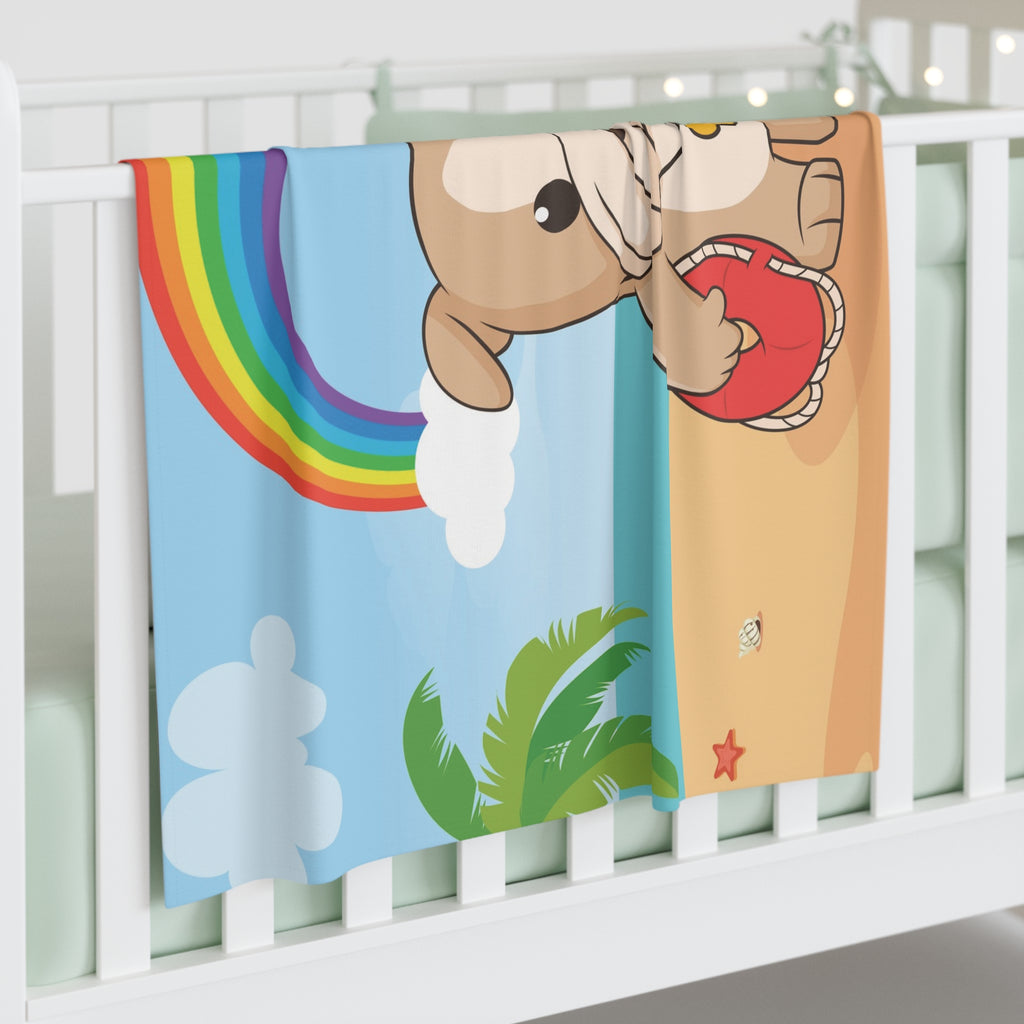 Full-color swaddle blanket with a dog lifeguard standing on a beach with a rainbow in the background. The blanket is draped over the side of a baby crib.