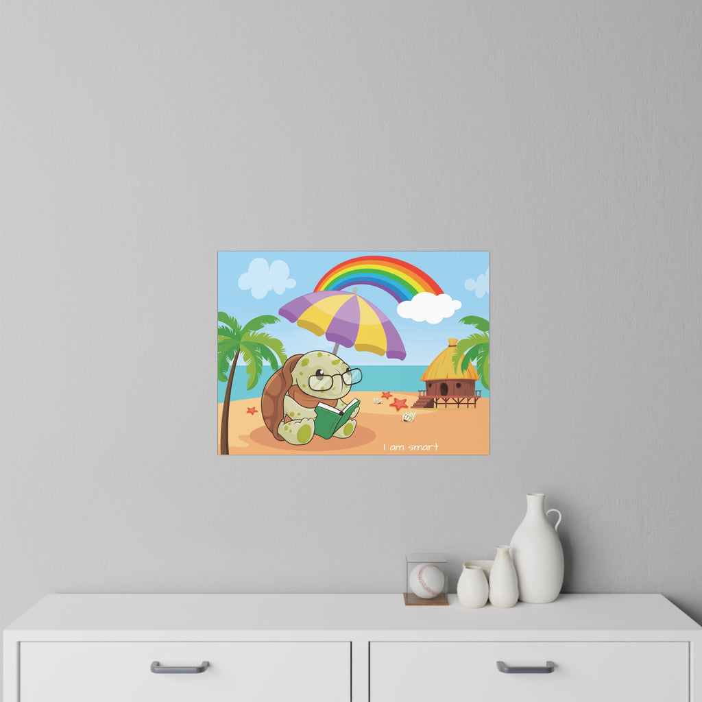A 24 by 18 inch wall decal on a grey wall above a dresser. The wall decal has a scene of a turtle reading a book under an umbrella on the beach, a rainbow in the background, and the phrase "I am smart" along the bottom.