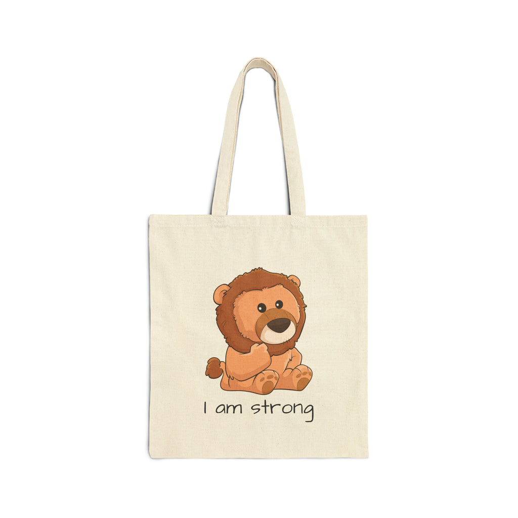 A natural tan tote bag with a picture of a lion that says I am strong.