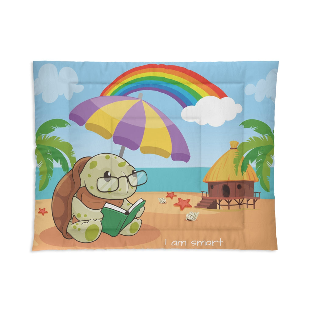 A 68 by 88 inch bed comforter with a scene of a turtle reading a book under an umbrella on a beach, a rainbow in the background, and the phrase "I am smart" along the bottom.