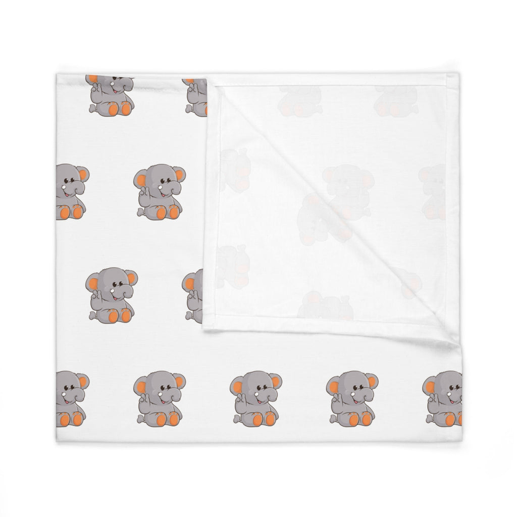 A white swaddle blanket with a repeating pattern of an elephant. The blanket is folded into a square.