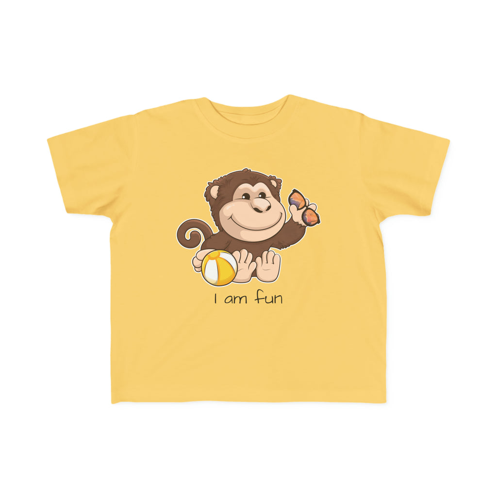 A short-sleeve yellow shirt with a picture of a monkey that says I am fun.