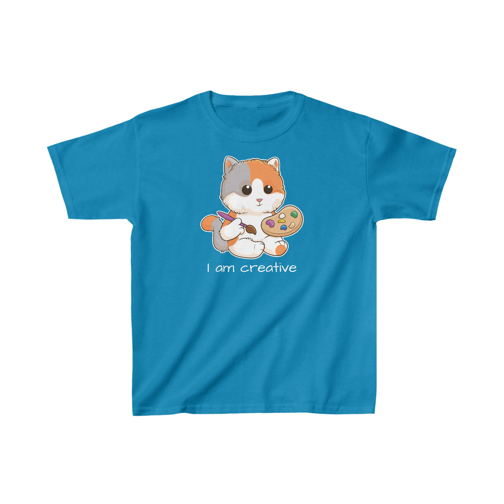 A short-sleeve sapphire blue shirt with a picture of a cat that says I am creative.