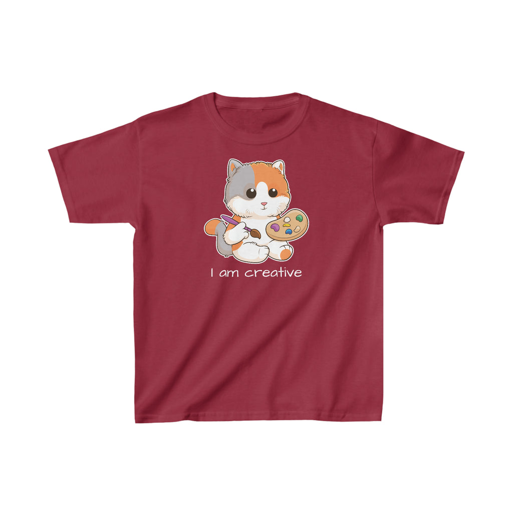 A short-sleeve cardinal red shirt with a picture of a cat that says I am creative.