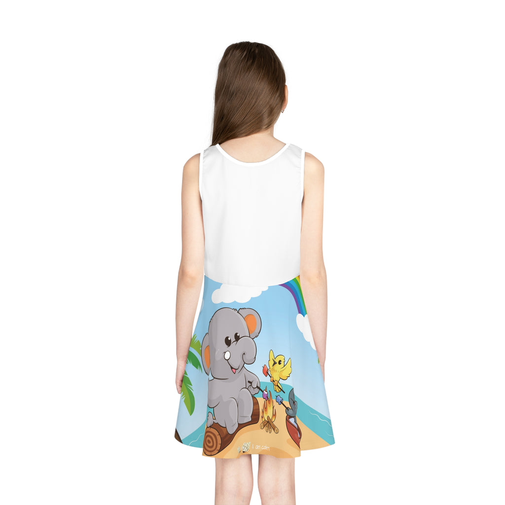 Back-view of a girl wearing a sleeveless dress. The dress has a white top and the skirt features a scene of an elephant having a bonfire with a bird and fish on the beach and the phrase "I am calm" along the bottom.