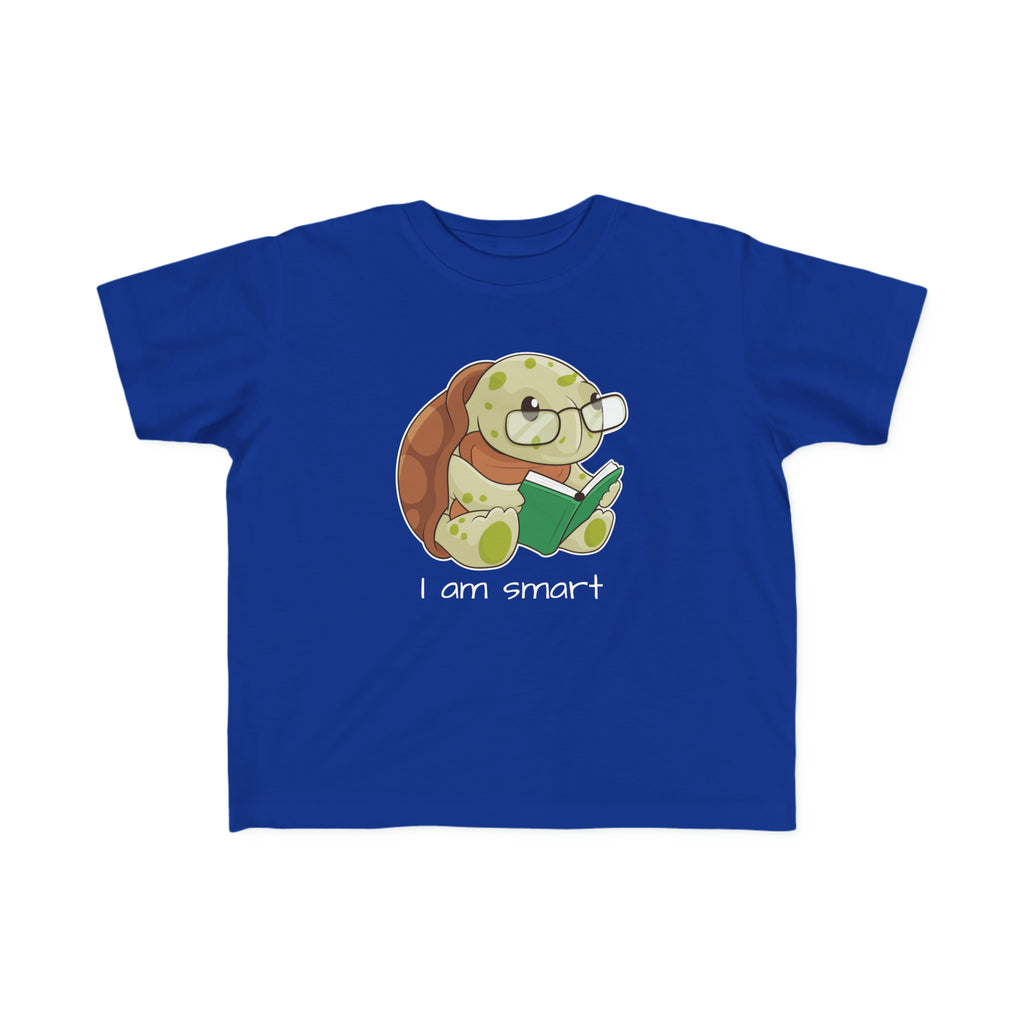 A short-sleeve royal blue shirt with a picture of a turtle that says I am smart.