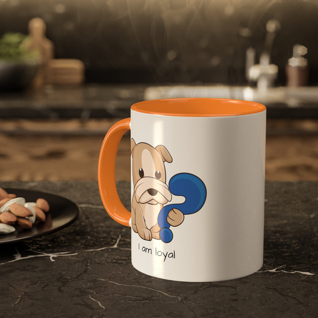 A white mug with a golden yellow handle and interior and a picture of a dog that says I am loyal. The mug sits on a black kitchen counter and has steam rising out of it.
